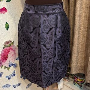 Vintage 1980/1990’s Harriet Selling purple and black paisley mini skirt. Size S.